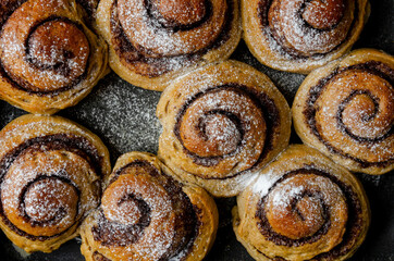Fototapeta premium buns made from banana dough with chocolate and cinnamon.