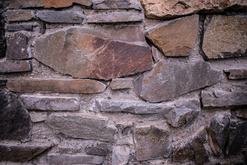 Old walls. Old masonry. Stone background. Garden fence
