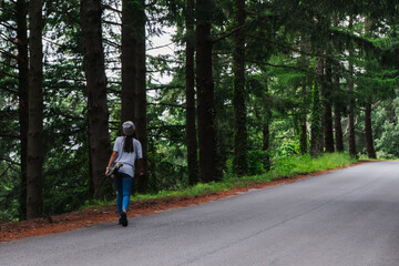 Woman with longboard walking