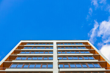 modern building architecture exterior facade urban view from below on clear vivid blue sky background space for copy or your text