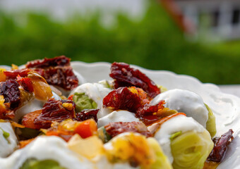 Brussels sprout salad with dried tomatoes and yogurt macro
