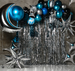 Space photo zone with blue and silver stars, ballons, large for birthday decor. Holiday decoration. Balloons