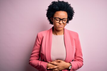 Young beautiful African American afro businesswoman with curly hair wearing pink jacket with hand...