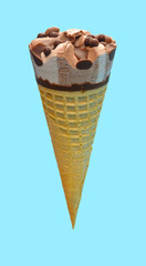 side view fresh chocolate flavor ice cream cone on a blue background
