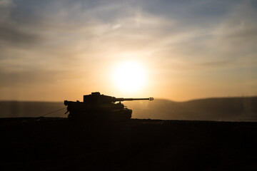 War Concept. Military silhouettes fighting scene on war fog sky background, World War Soldiers...
