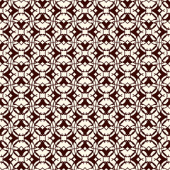 Floral mosaic tile ornament. Ethnic, tribal background. Ornamental seamless surface pattern. Repeated abstract flowers