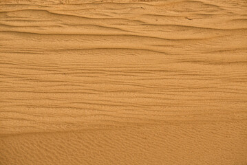 Wave of sand texture. Yellow sand texture for background.Beautiful waves on sand.