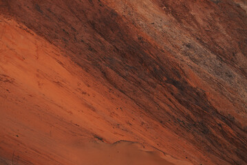 Red clay quarry. Clay quarry. Top view of a sand excavation site. Earth rocks are digging for building materials. Beautiful natural landscape to the land. Quarry with sand, sand loading, ground water,