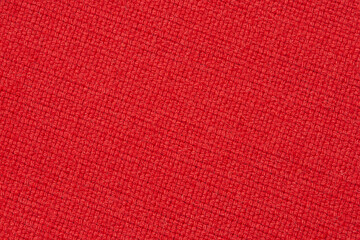 Fototapeta premium red wool fabric texture, diagonally arranged upholstery cloth background