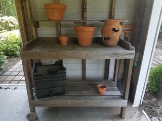 Fototapeta na wymiar wood storage rack with clay or terracotta pots