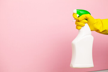 Hand in a yellow glove for cleaning