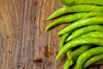 Fresh Green Chilies on Wooden Background top View Close-Up Stock Photograph Image