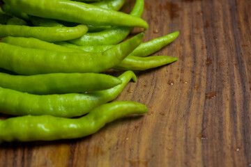 Fresh Green Chilies on Wooden Background top View Close-Up Stock Photograph Image