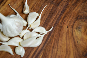 Garlic and Garlic Cloves on a Vintage Wooden Background