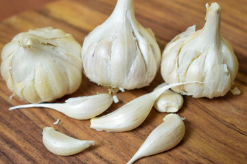 Garlic and Garlic Cloves on a Vintage Wooden Background