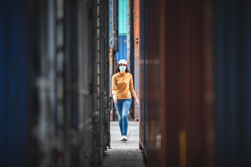 Portrait of an Asian woman wearing a surgical mask to prevent the infection from the coronavirus COVID-19 virus.