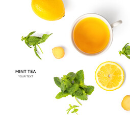 Creative layout made of cup of mint tea, lemon, ginger on a white background. Top view.