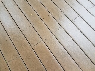 wet brown composite wood deck
