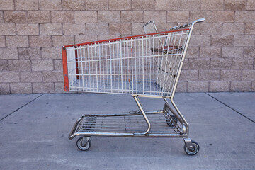Supermarket trolley on the street outside the store