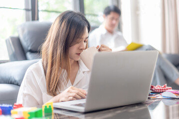 Business woman use phone for conference meeting by internet to work from home