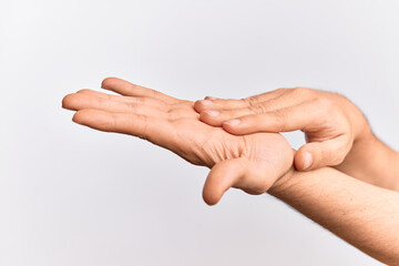 Hand of caucasian young man showing fingers over isolated white background touching palms gentle, delicate beauty pose