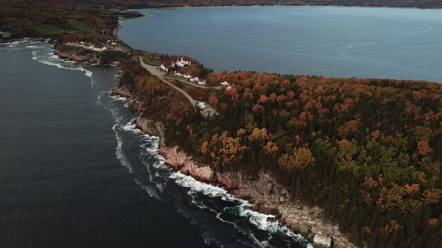 Stunning views of the Atlantic Ocean along the coasts of Cape Breton along the Cabot Trails, Nova Scotia during Autumn. Fall foliage  with multi colored deciduous trees Middlehead Trail.	