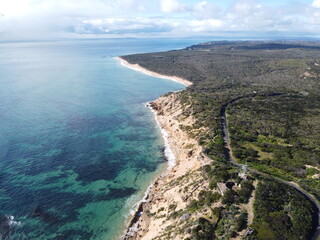 Obraz premium Aerial view of waves and island Australian landscape