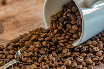 coffee beans background  with white coffee mug