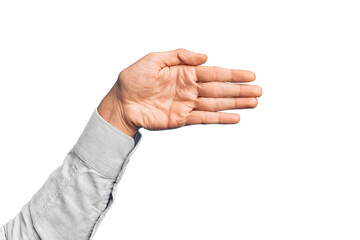 Hand of caucasian young man showing fingers over isolated white background stretching and reaching with open hand for handshake, showing palm