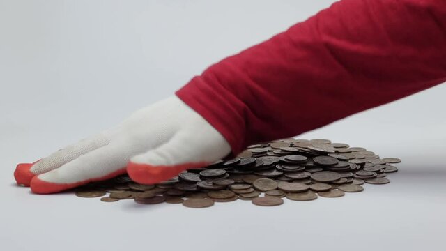 a pile of old USSR coins and a gloved hand