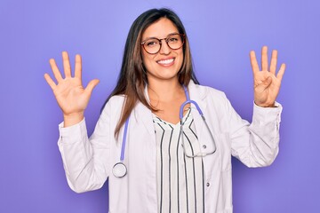Professional doctor woman wearing stethoscope and medical coat over purple background showing and pointing up with fingers number nine while smiling confident and happy.