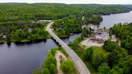 Obraz na płótnie Canvas Aerial View of Rural Landscape Background with Bridge and River in Muskoka, Ontario, Canada