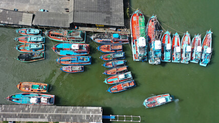 Fototapeta na wymiar Fleet of fishing boats in port in Thailand. 