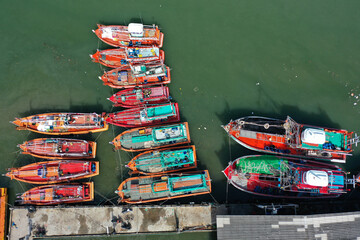 Fototapeta na wymiar Fleet of fishing boats in port in Thailand. 