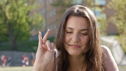 A young girl recording a TikTok challenge video.