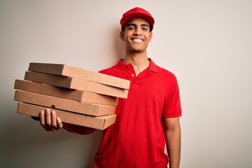 Handsome african american delivery man holding boxes of italian pizza over white background with a happy face standing and smiling with a confident smile showing teeth