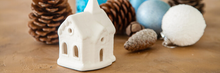 Lodge and Christmas tree decorations and cones on a concrete background, selective focus