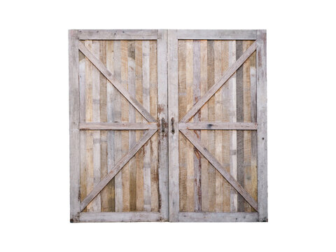 wooden closed door of old barn isolated on white background.