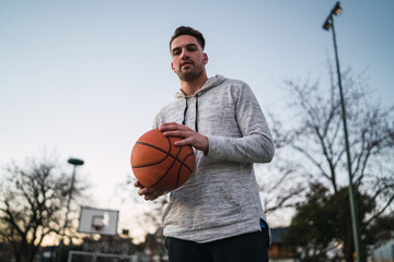Young man playing basketball.