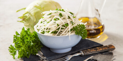 salad from a kohlrabi with green onions, selective focus