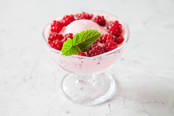 ice cream with raspberry in an ice-cream bowl, selective focus