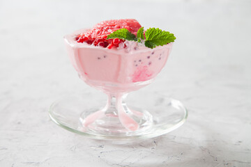 ice cream with raspberry in an ice-cream bowl, selective focus