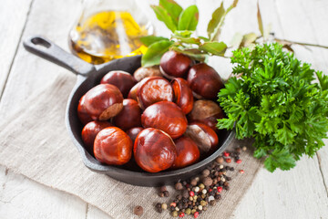 chestnuts on a table with spices, selective focus