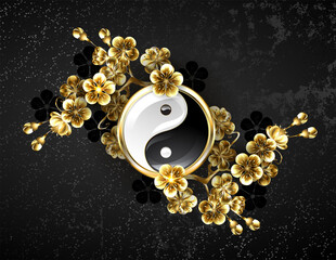 Yin yang symbol with golden sakura