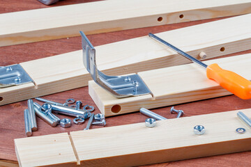 the process of assembling wooden furniture with your own hands tools and screws on the details