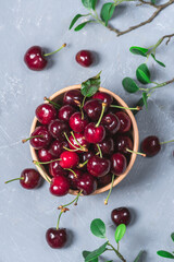 Fresh cherries in bowl on table
