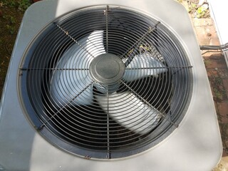 air conditioner unit or fan with blades spinning