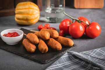 Traditional American street food corn dogs with ketchup