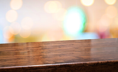 Wood diagonal table at restaurant blur background.coffee shop with bokeh light,Mockup  banner for display of product