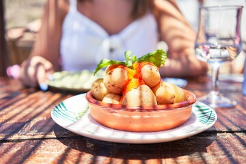 Delicious plate with potatoes and sauce